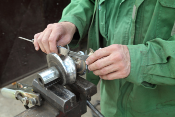 Man doing metalwork Man doing metalwork
